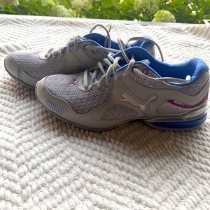 Puma sneakers with blue and purple details.